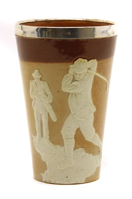 Lot 131 - A Royal Doulton golfing beaker