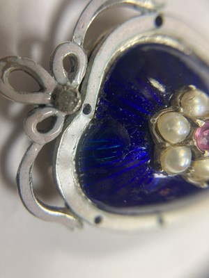 Lot 23 - A gold and silver, ruby, split pearl, diamond and enamel heart pendant