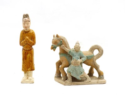 Lot 218 - A Chinese Tang Dynasty AD 618-907 white pottery moulded figure of a male groom