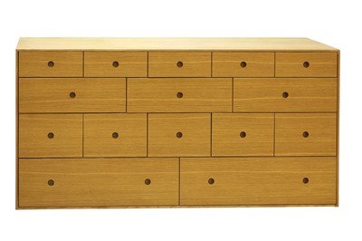 Lot 618 - A contemporary oak veneered chest of drawers