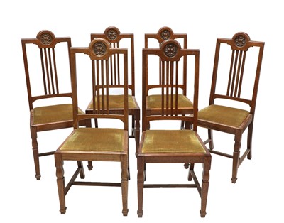 Lot 23 - A set of six oak dining chairs