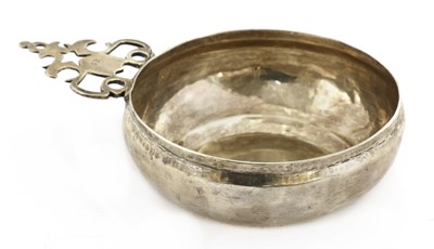 Lot 800 - A Charles II silver bleeding bowl