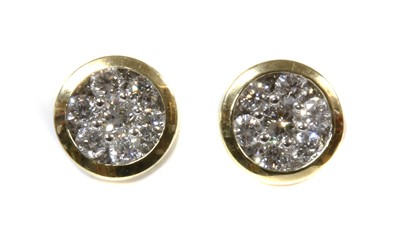 Lot 137 - A pair of gold diamond cluster earrings