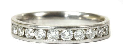 Lot 82 - A white gold diamond half eternity ring