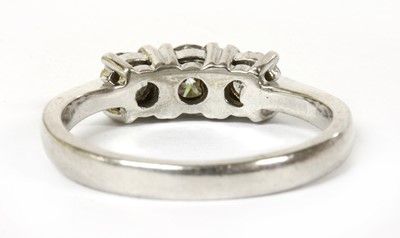 Lot 81 - A 9ct white gold three stone diamond ring
