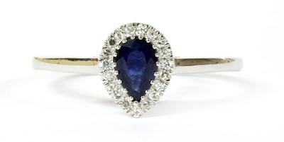 Lot 111 - A white gold sapphire and diamond cluster ring