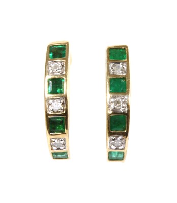 Lot 143 - A pair of 9ct gold emerald and diamond 'J' hoop earrings