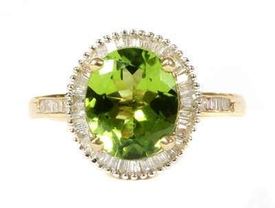 Lot 150 - A gold peridot and diamond cluster ring