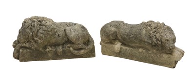 Lot 392 - A pair of composite stone lions