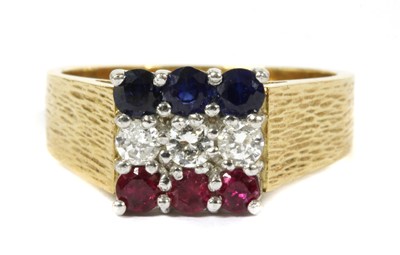 Lot 135 - An 18ct gold ruby, diamond and sapphire ring, c.1980
