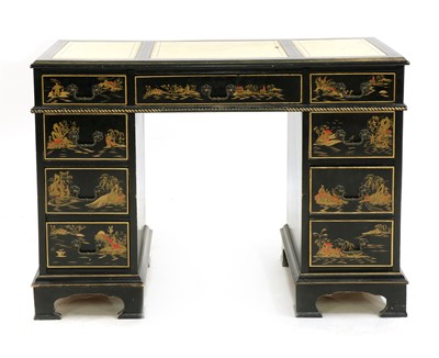 Lot 331 - A black lacquer pedestal desk