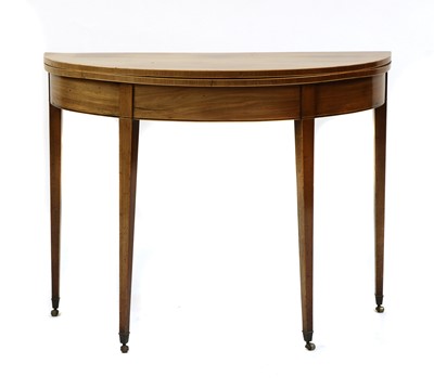 Lot 307 - A mahogany fold over tea table
