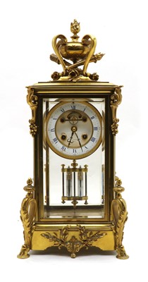 Lot 129 - A late 19th century ormolu glass mounted mantel clock