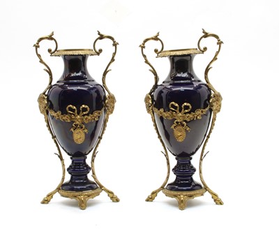 Lot 176 - A pair of ormolu mounted blue porcelain vases