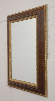 Lot 217 - A modern burr walnut and parcel-gilt cushion moulded wall mirror