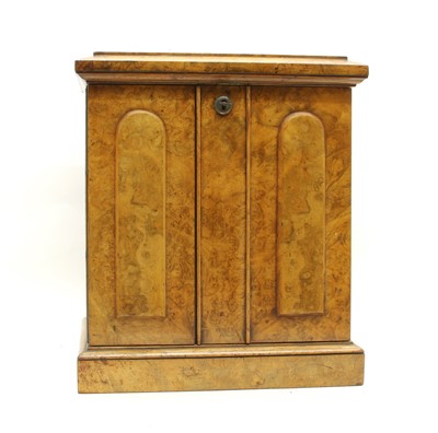 Lot 82 - A small Victorian walnut table top cabinet of drawers