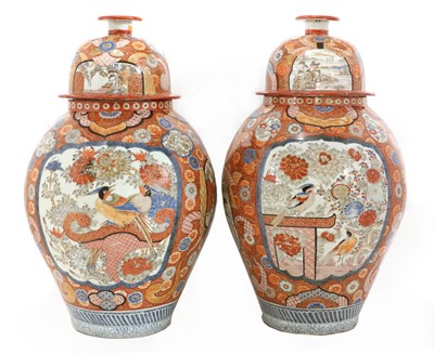 Lot 9 - A large pair of Imari vases and covers