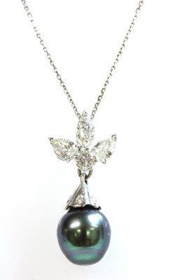 Lot 220 - A white gold diamond and cultured pearl pendant and earrings suite