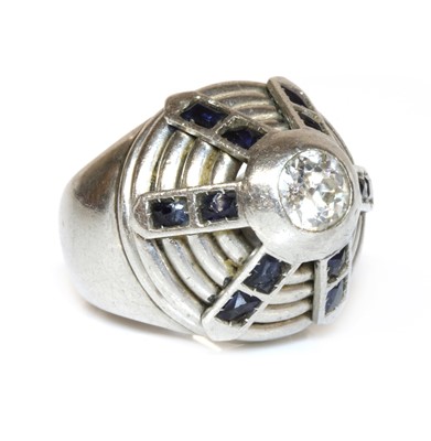 Lot 182 - A diamond and synthetic sapphire bombé ring, c.1940
