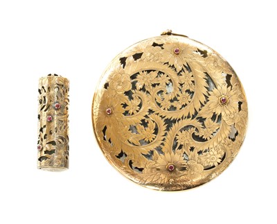 Lot 189 - A silver and gold ruby set compact and lipstick holder, by Boucheron