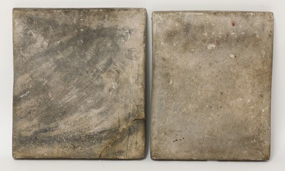 Lot 947 - A near pair of Qajar pottery tiles