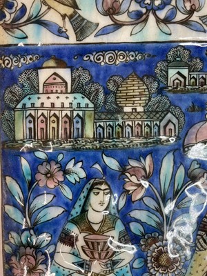 Lot 947 - A near pair of Qajar pottery tiles