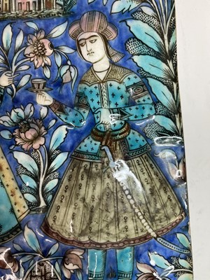 Lot 947 - A near pair of Qajar pottery tiles