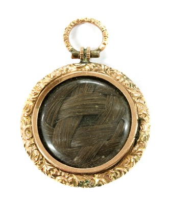 Lot 6 - A Victorian gold mounted shakudo memorial locket