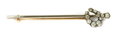 Lot 16 - A gold diamond set horseshoe bar brooch
