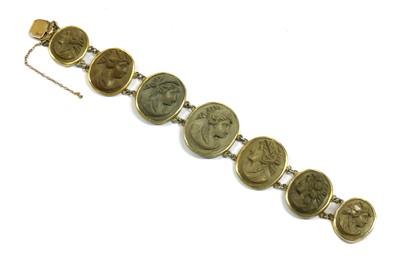 Lot 11 - A gilt metal lava stone cameo bracelet