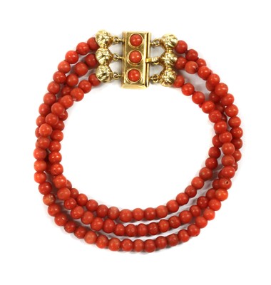 Lot 40 - A three row uniform coral bead bracelet