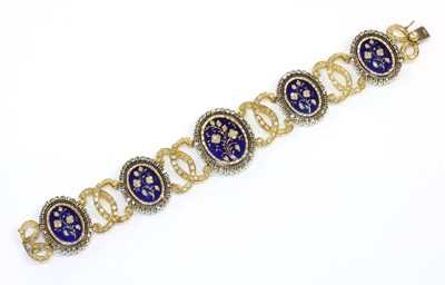 Lot 204 - A two colour gold diamond and enamel plaque bracelet