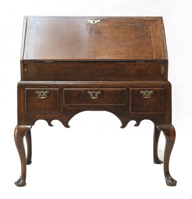 Lot 96 - An oak bureau on stand