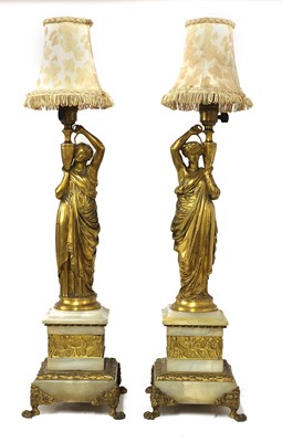 Lot 183 - A pair of neoclassical ormolu table lamps