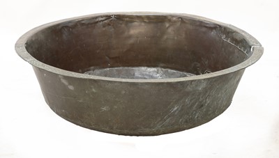 Lot 749 - A riveted and patch repaired round brass bath
