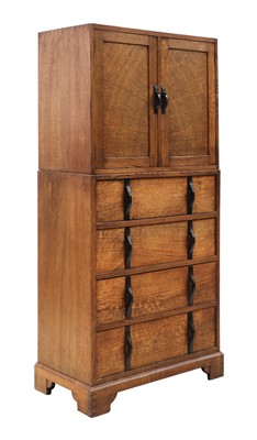 Lot 88 - A Gordon Russell oak two-part cabinet and chest