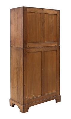 Lot 88 - A Gordon Russell oak two-part cabinet and chest
