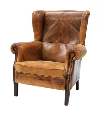Lot 544 - A George III-style leather wingback armchair