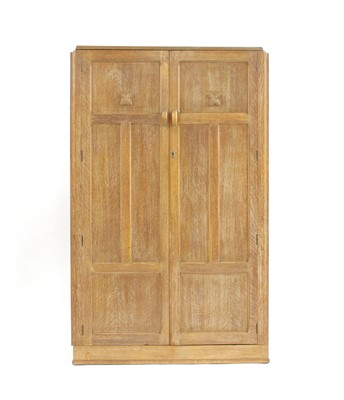 Lot 280 - A Heals style limed oak wardrobe