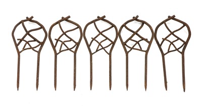 Lot 386 - A collection of wrought iron lawn edging