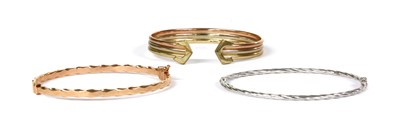 Lot 199 - A 9ct three colour gold torque bangle