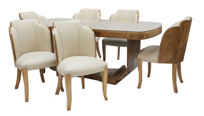 Lot 189 - An Art Deco burr walnut dining suite