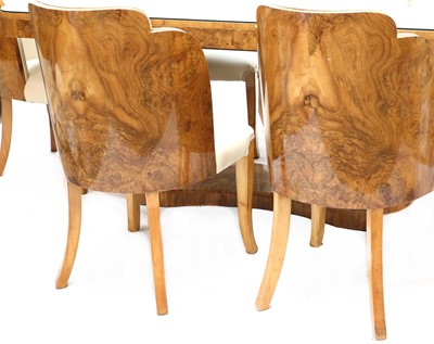 Lot 189 - An Art Deco burr walnut dining suite