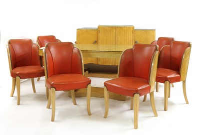 Lot 105 - An Art Deco burr maple dining suite