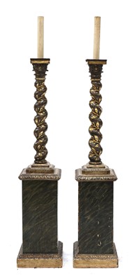 Lot 168 - A pair of carved wooden lamp standards