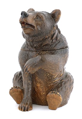 Lot 64 - A Black Forest carved wooden bear tobacco jar