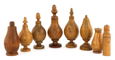 Lot 750 - A collection of eight treen powders and shakers