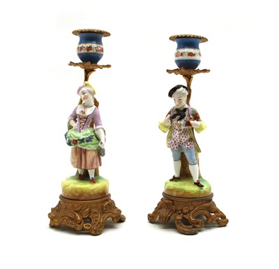 Lot 46 - Two pairs of candlesticks and a lamp base