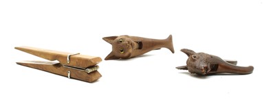 Lot 68 - Three pairs of wooden novelty nut crackers