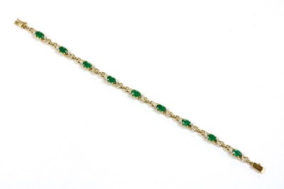 Lot 101 - A 9ct gold emerald and diamond bracelet